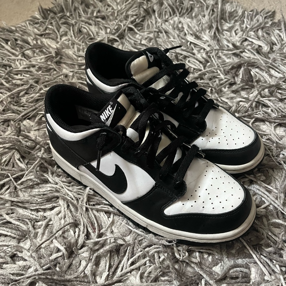 Women’s black and white panda dunk lows